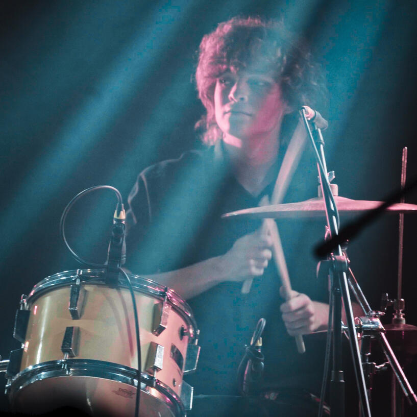 Drummer in pink & blue light